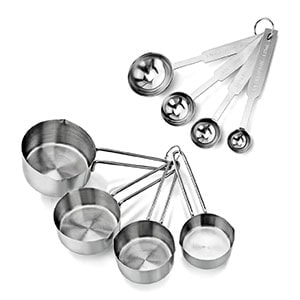 a set of measuring spoons and measuring cups on a white background.