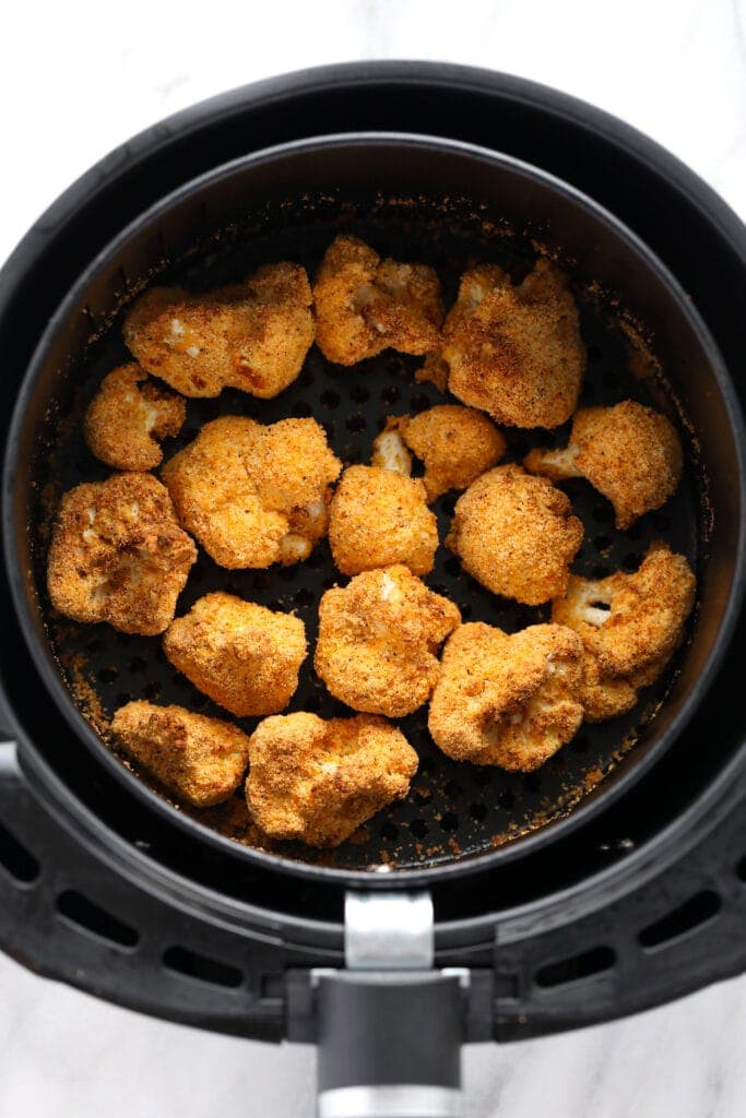 crunchy cauliflower in air fryer that is golden brown