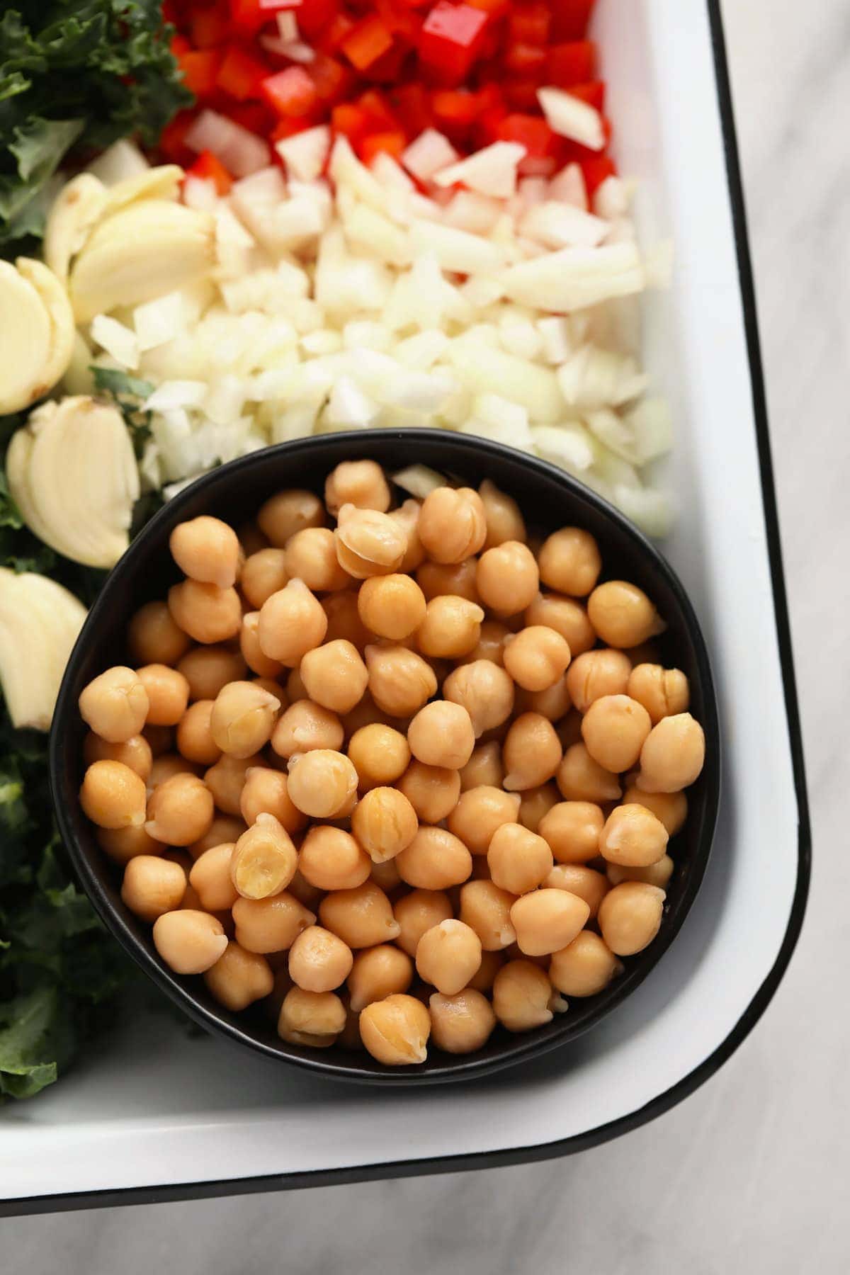 chickpeas in a bowl, ready to be added to chickpea curry