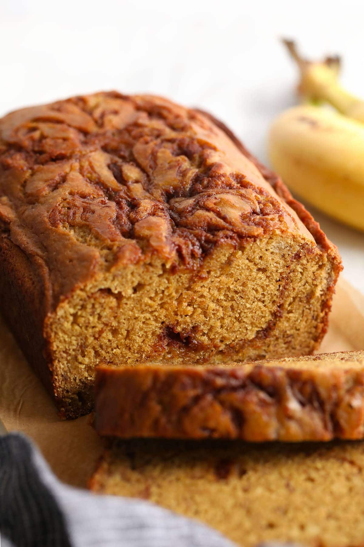 Cinnamon swirl banana bread cut into slices.