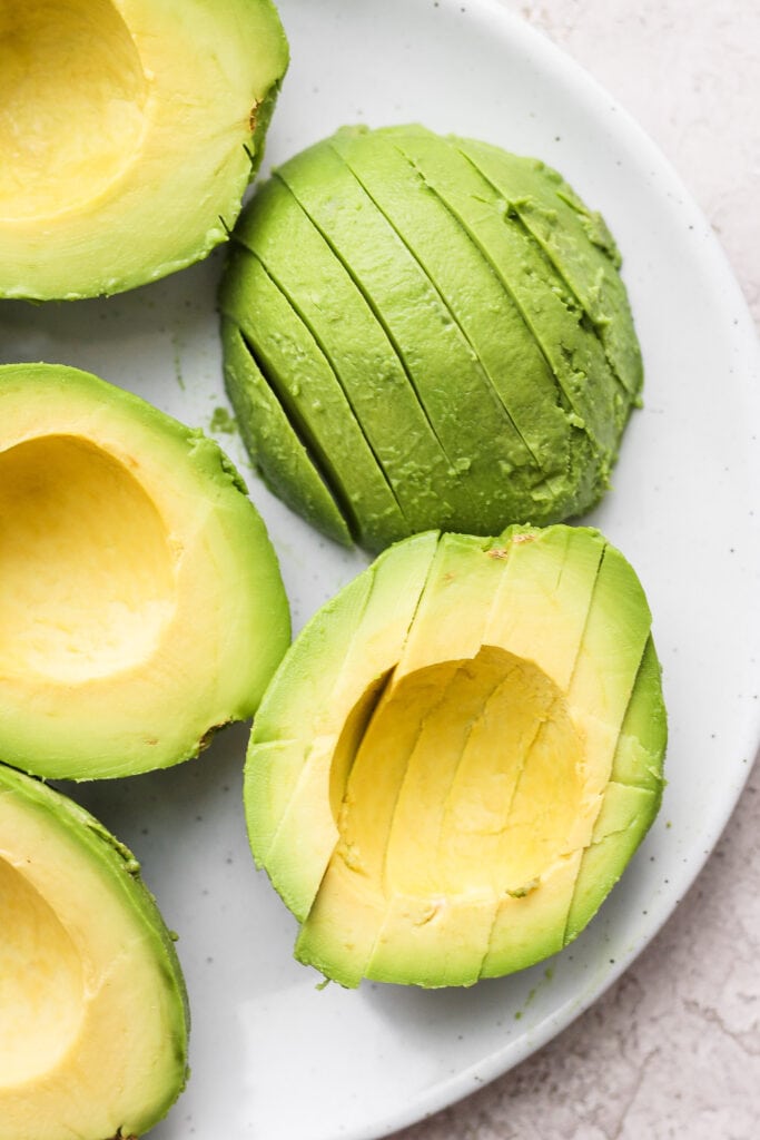 slices of avocado on a plate, ready to be frozen