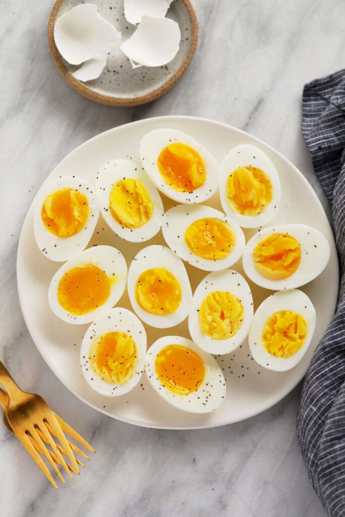 hard boiled eggs on plate with forks