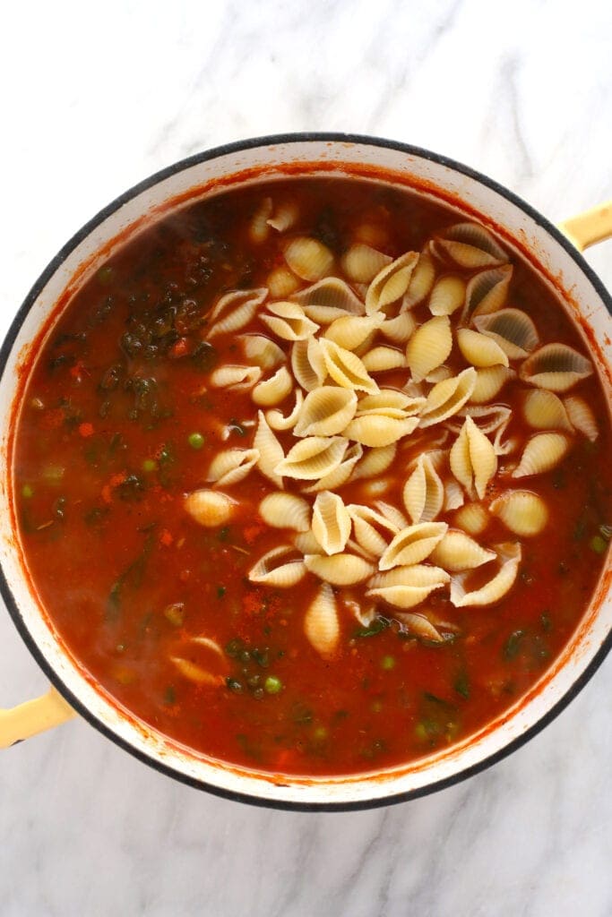 Noodles mixed in to minestrone soup. 