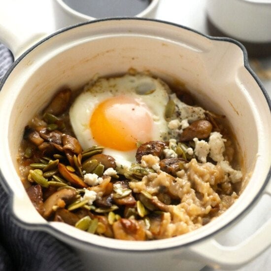 a bowl of oatmeal with a fried egg on top.