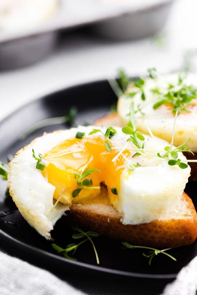 baked egg with runny yolk on bread