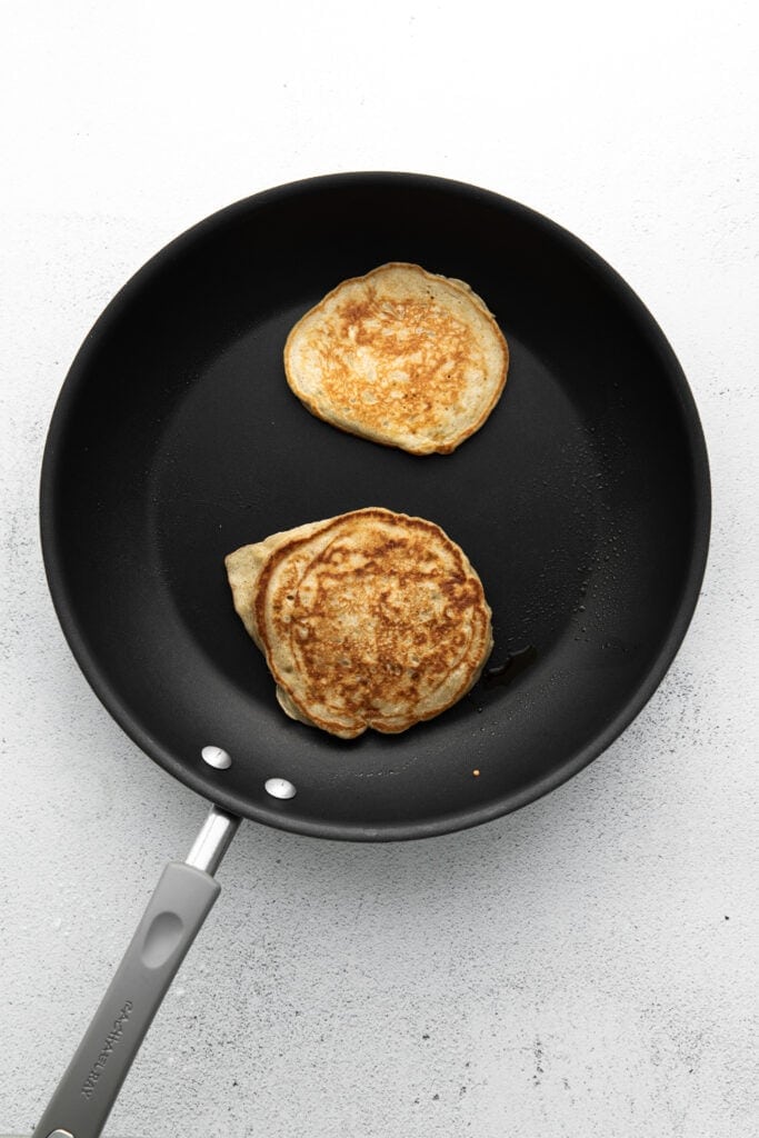 cooking pancakes in pan.