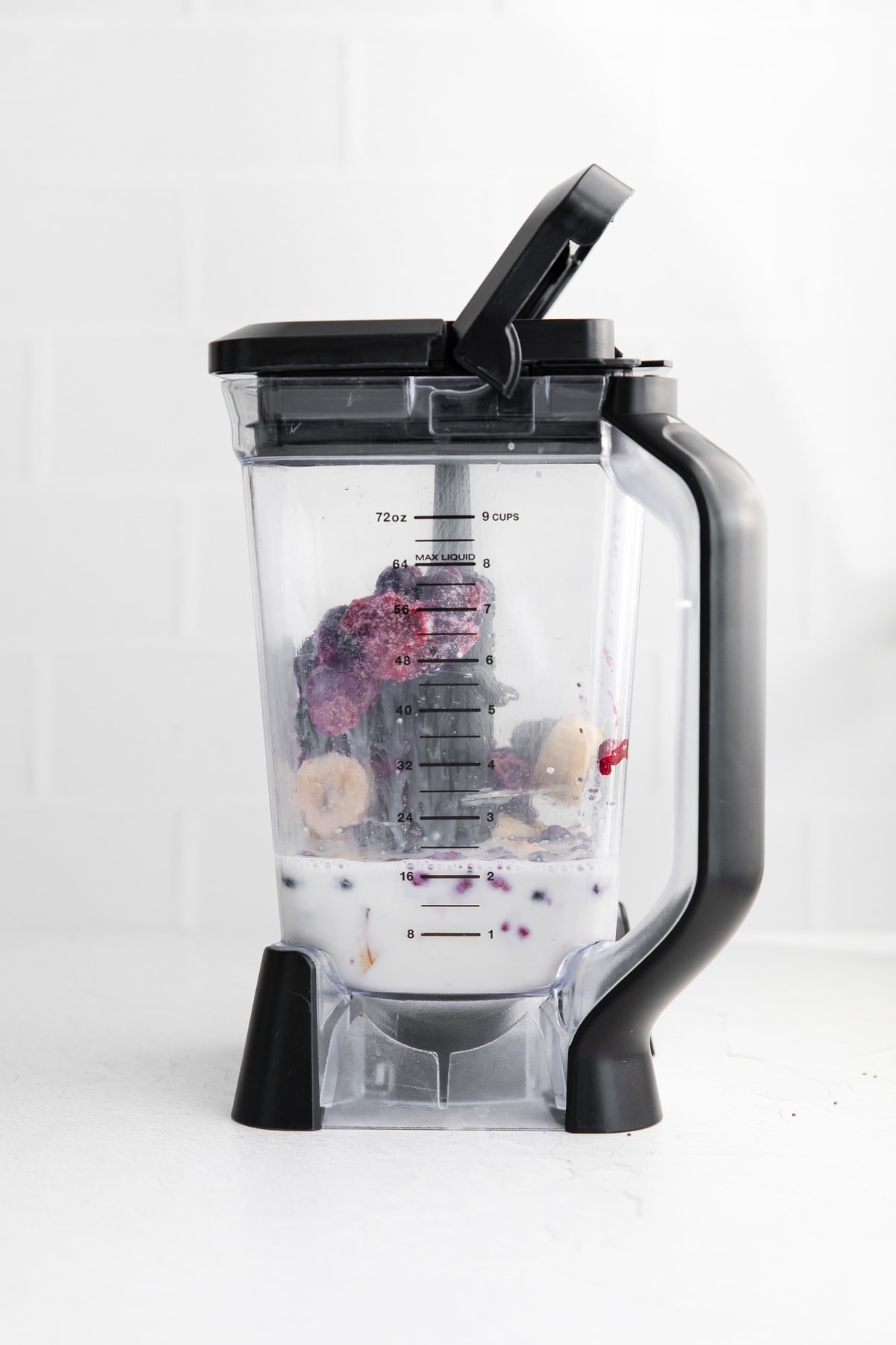 triple berry smoothie ingredients in a blender.