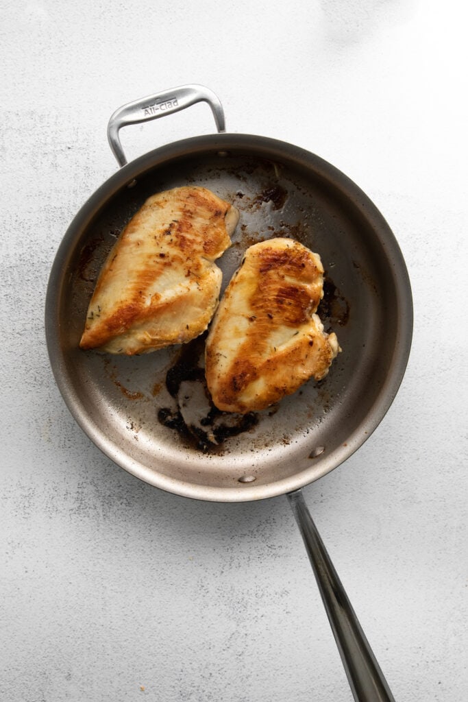 pan seared chicken in frying pan