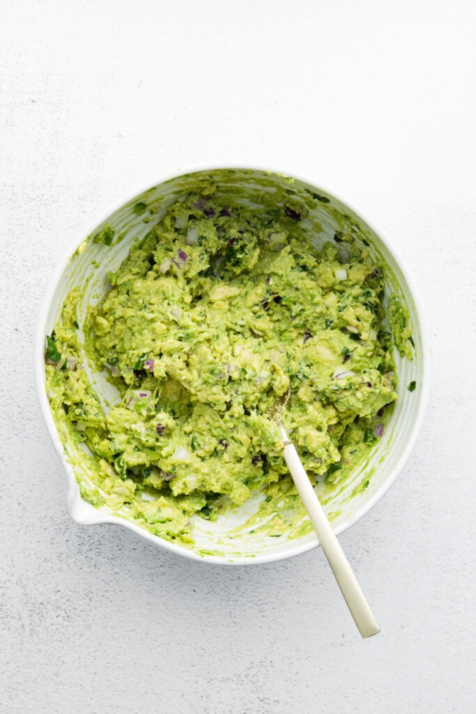 Homemade guacamole in a large bowl. 