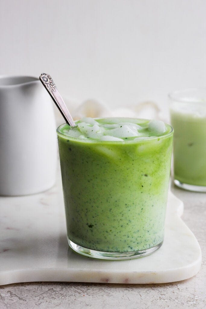 Matcha latte with ice in a glass. 