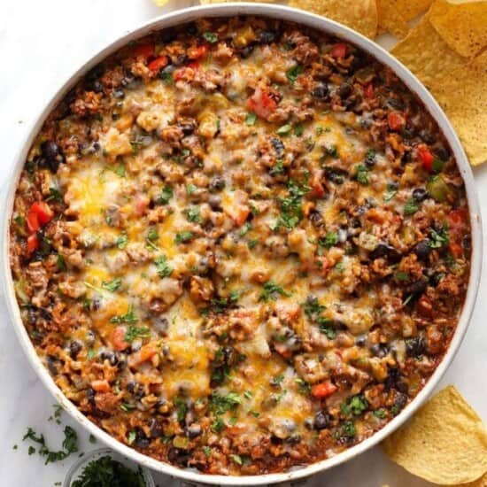 mexican ground beef skillet surrounded by chips