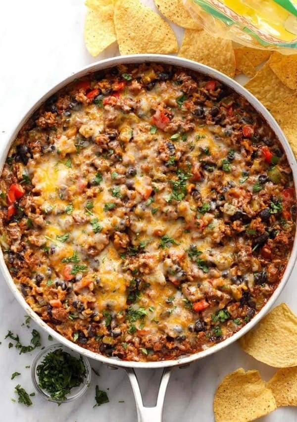 mexican ground beef skillet surrounded by chips