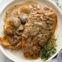Chicken breasts with mushroom sauce, inspired by the classic Chicken Marsala, served on a white plate.