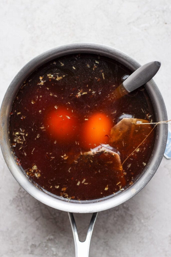 Marinating ramen eggs in a black tea mixture. 