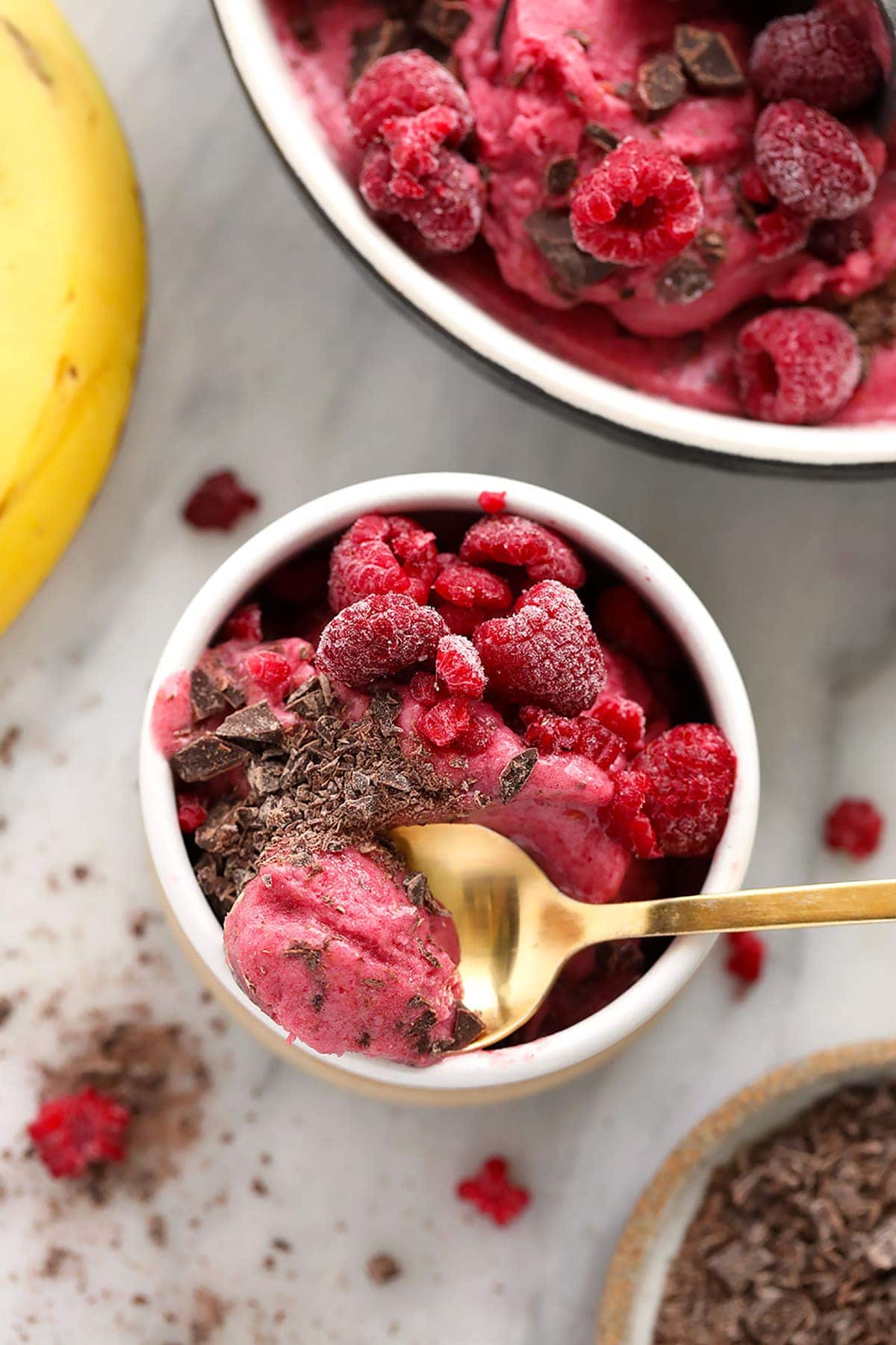 raspberry chocolate chunk banana nice cream in a bowl, ready to be enjoyed