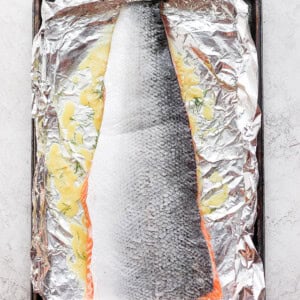 salmon marinating on foil.