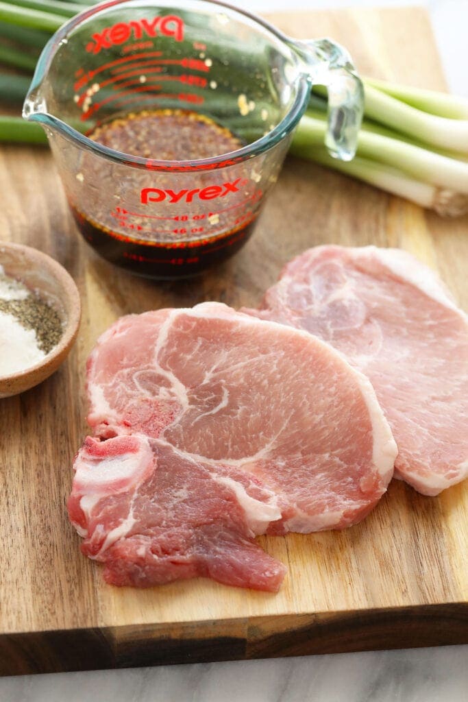 pork chops on cutting board