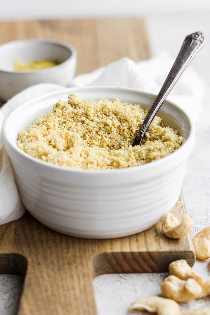 vegan parmesan cheese in a bowl with a spoon