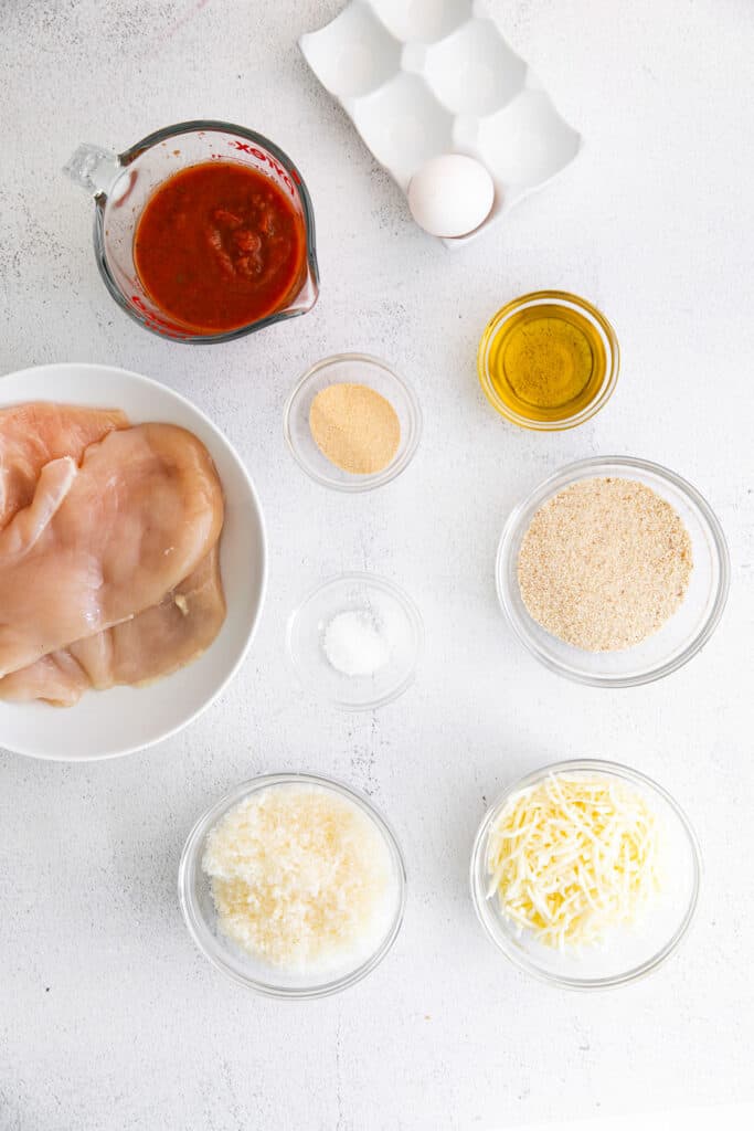 chicken parmesan ingredients on countertop.