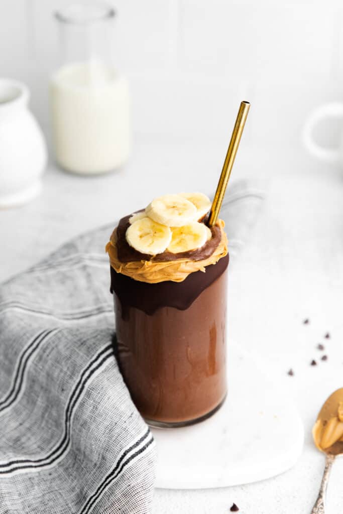 smoothie topped with peanut butter and banana
