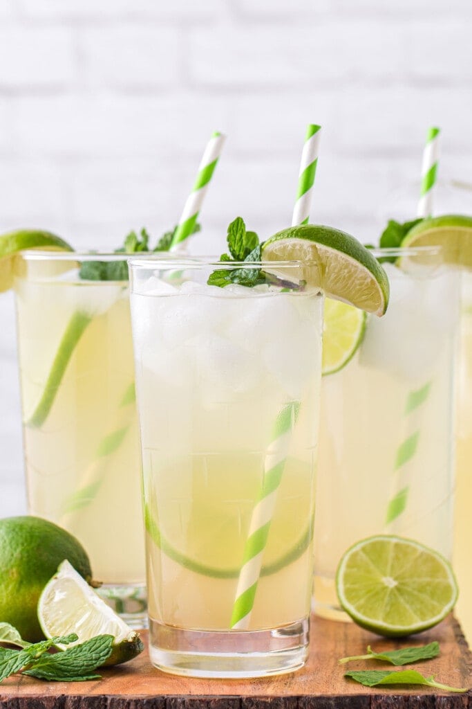 limeade in a glass garnished with a fresh lime slice and fresh mint
