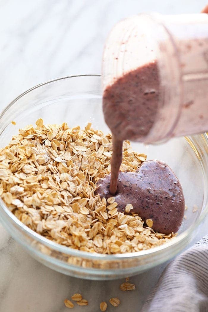 pouring wet ingredients into dry ingredients