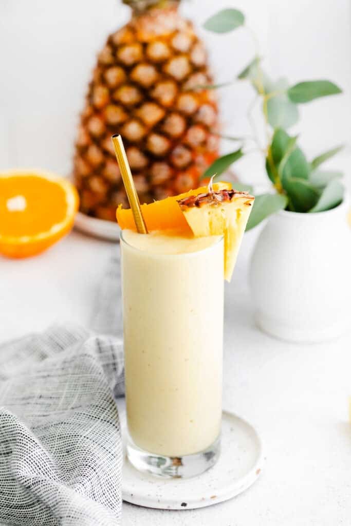 pineapple smoothie with orange and pineapple chunks
