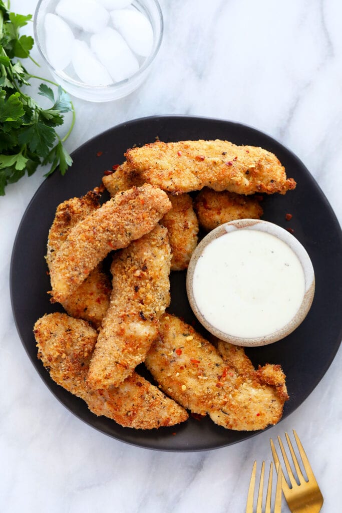 chicken tenders on plate with ranch
