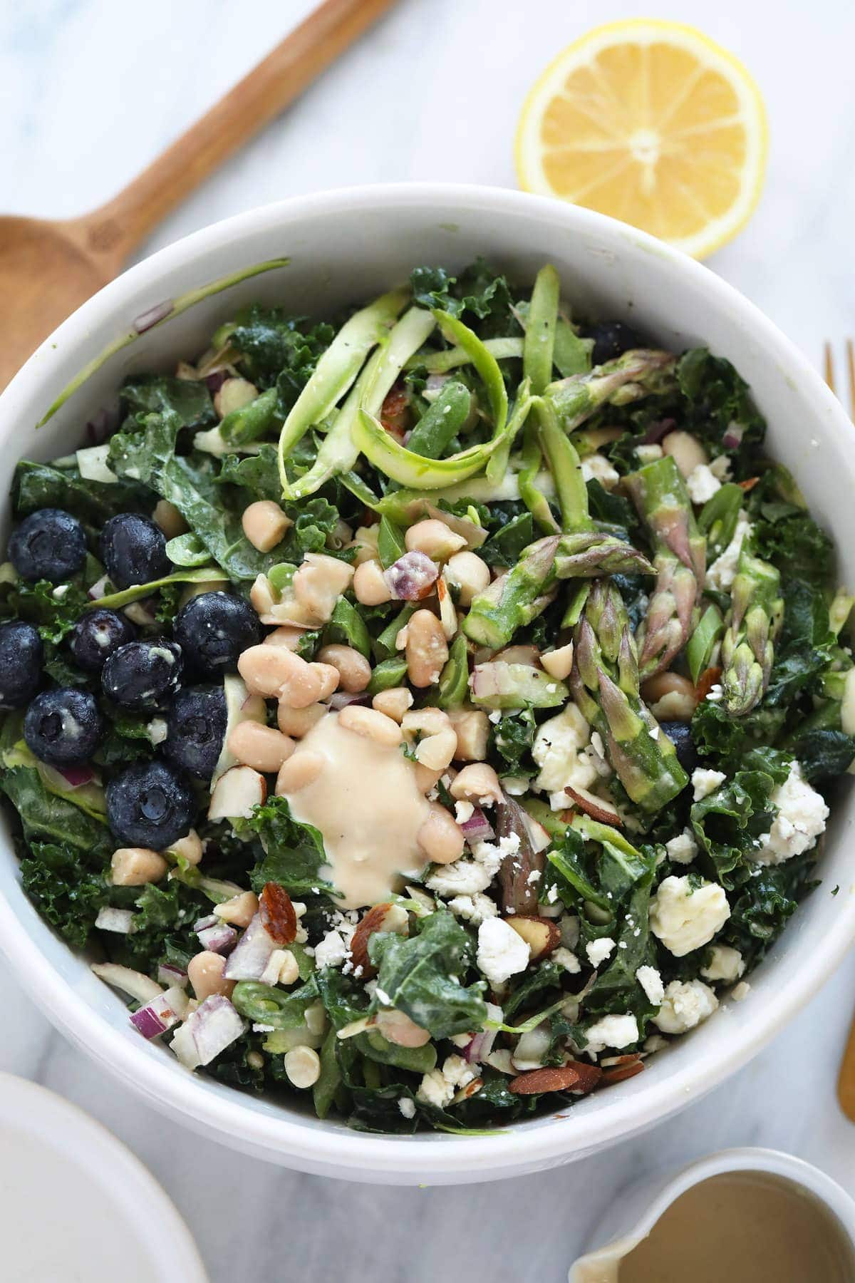 Asparagus salad in a mixing bowl. 