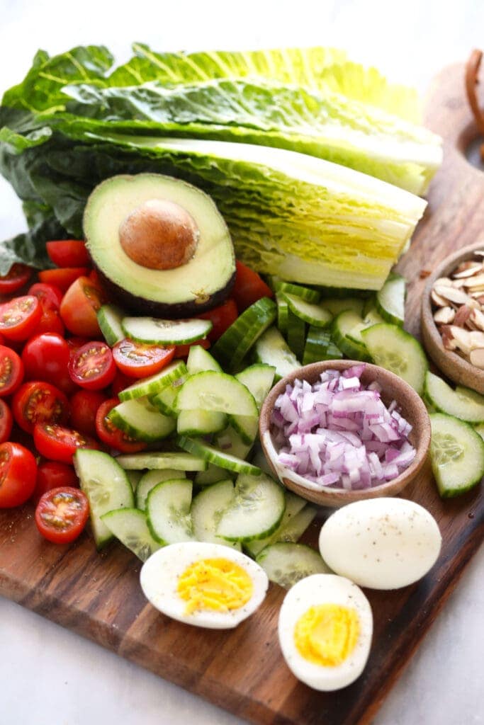 lettuce and veggies on cutting board