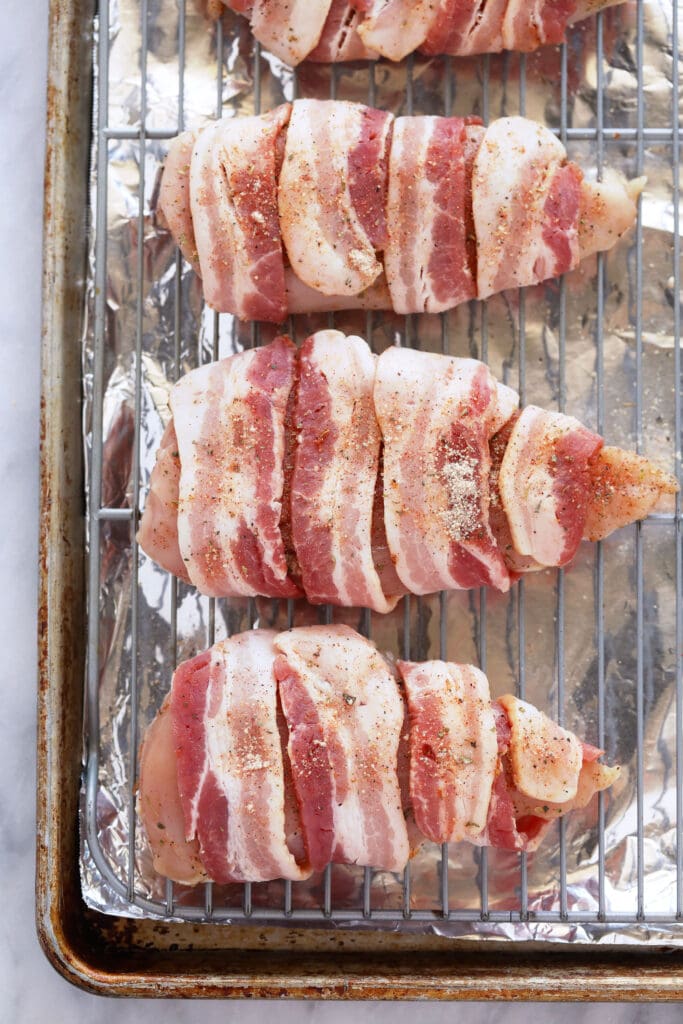 uncooked bacon wrapped chicken