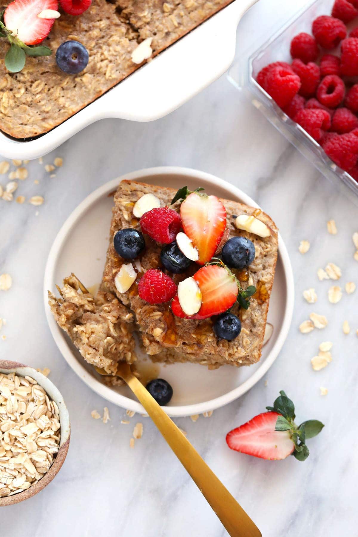 baked oatmeal on plate with berries