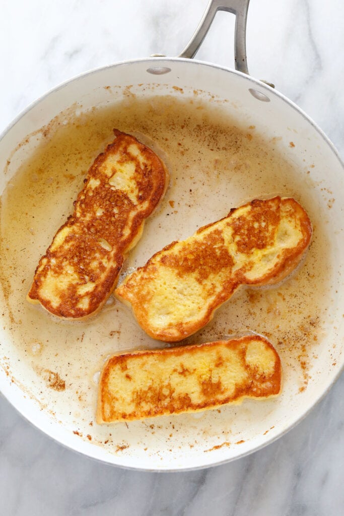 cooking French toast sticks in pan