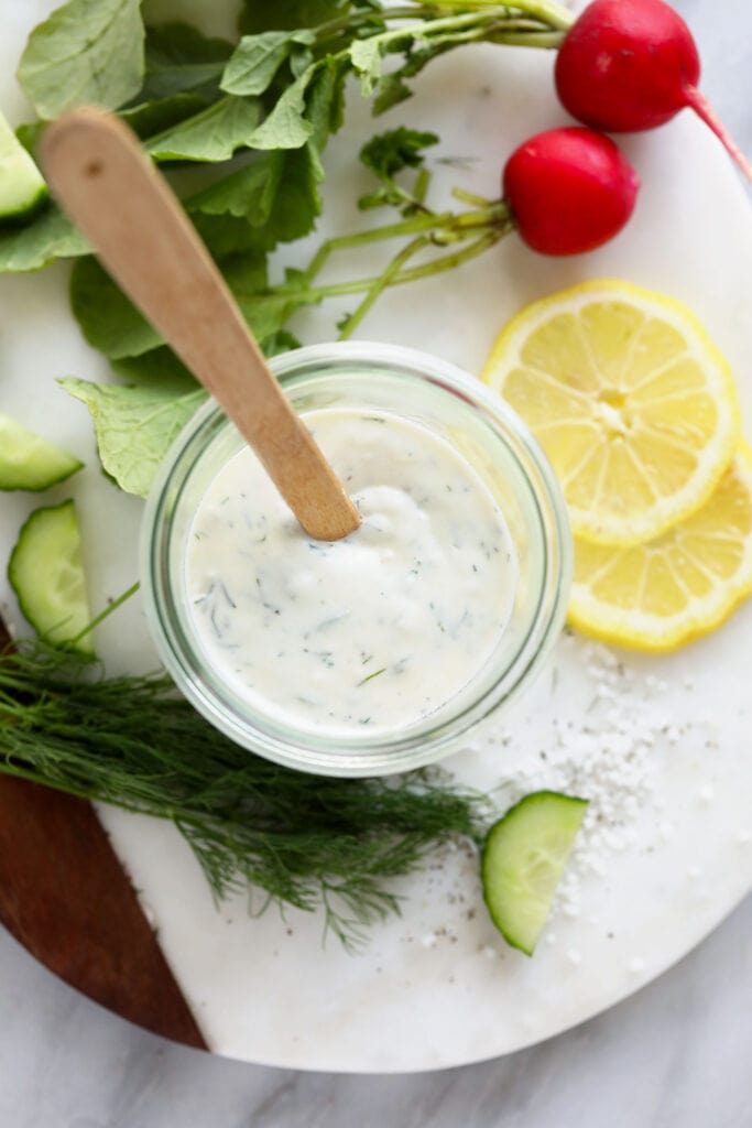 Greek yogurt dressing in mason jar with spoon