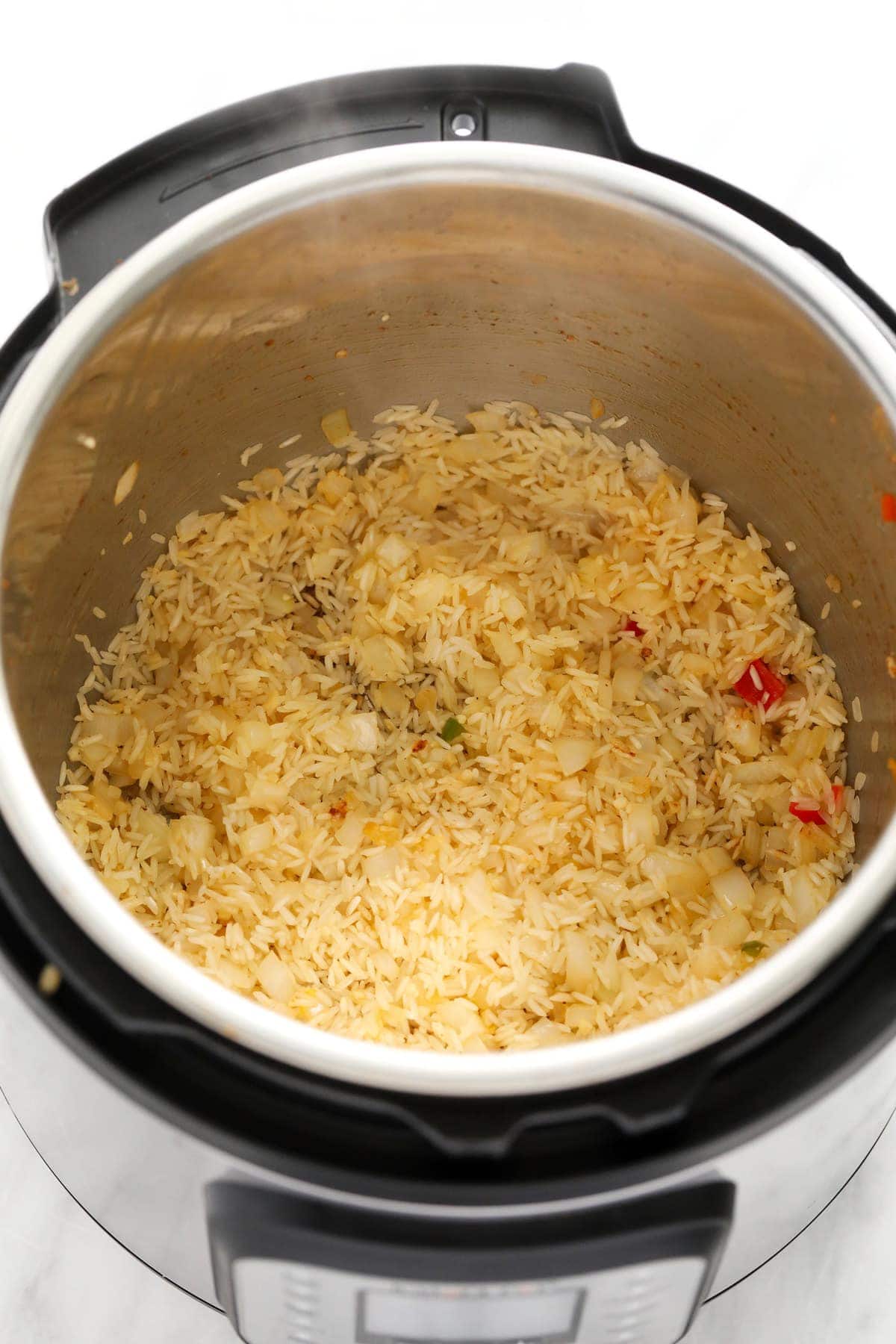 rice and onions in the instant pot for instant pot burrito bowls