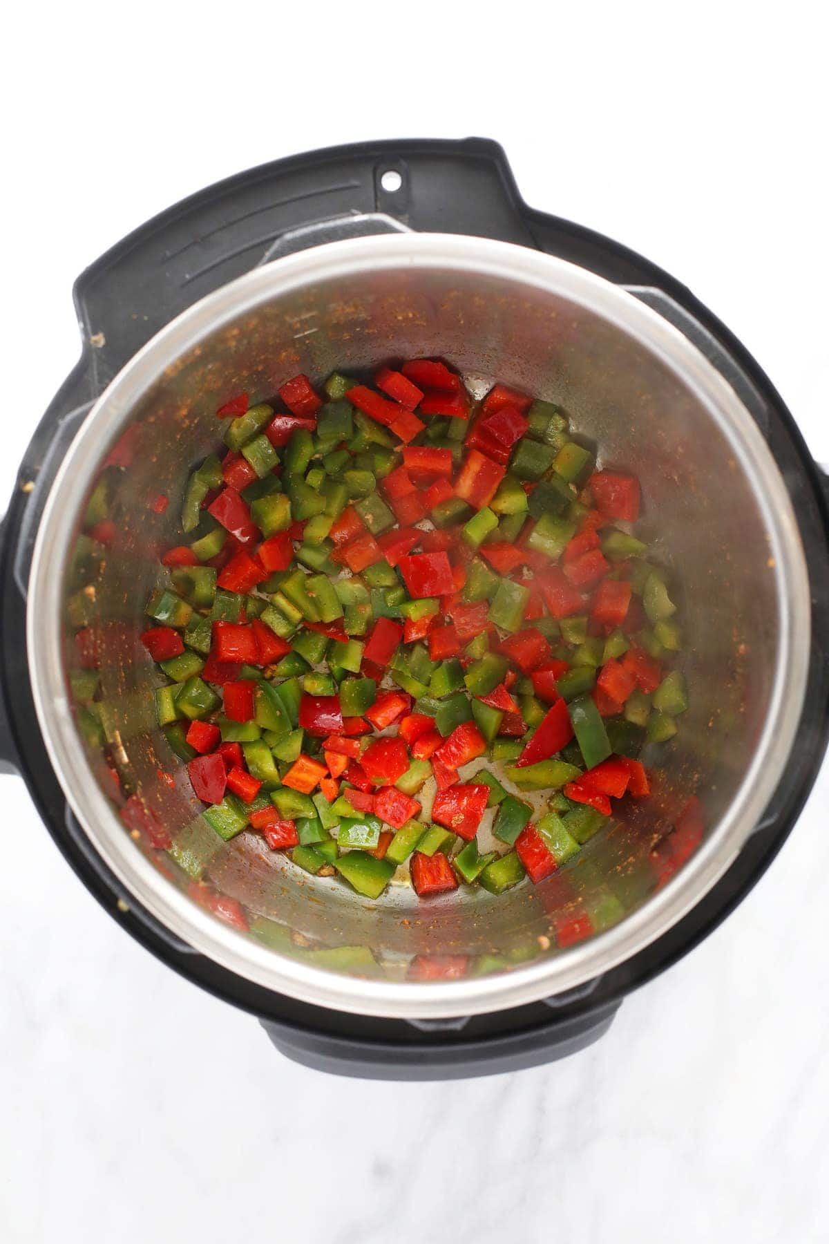 sauteed red and green peppers in the instant pot for instant pot burrito bowls