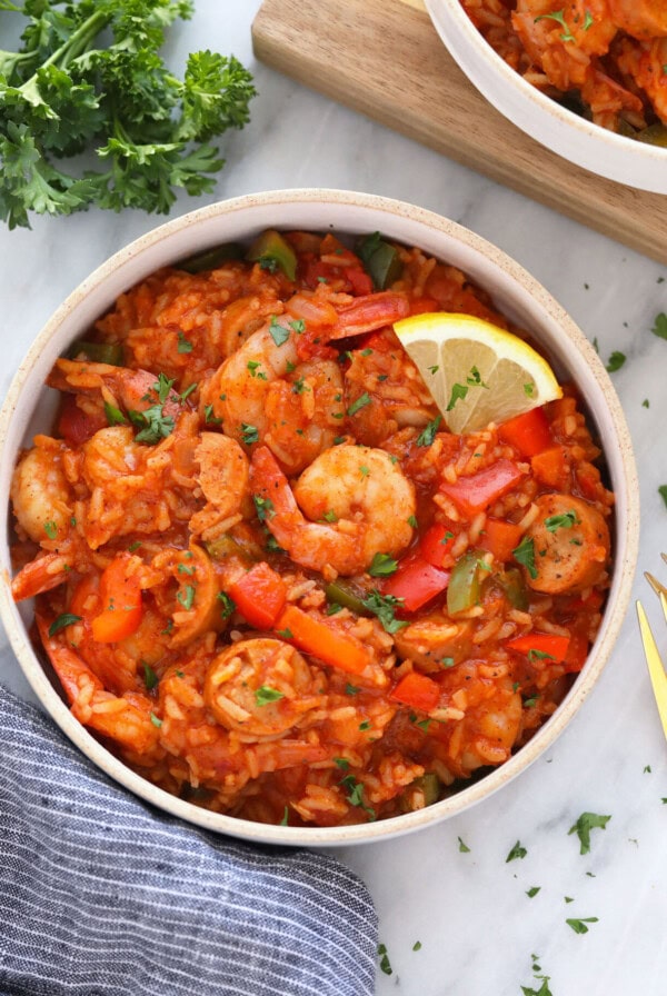 shrimp risotto in a white bowl.