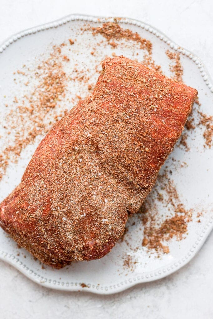 A pork roast dry rubbed in spices. 