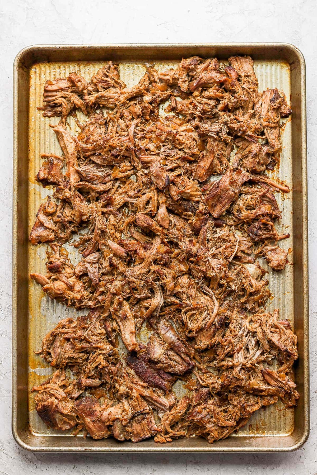 Carnitas on a baking sheet.