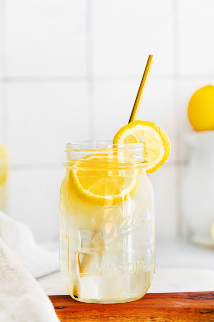 A mason jar full of lemonade. 