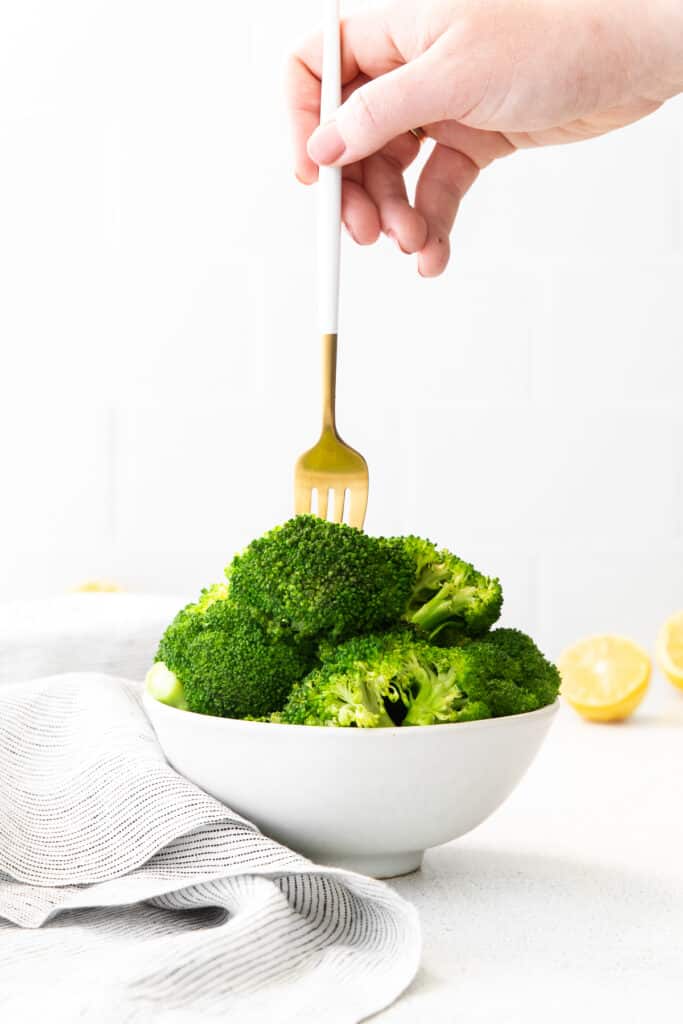 forking a piece of broccoli