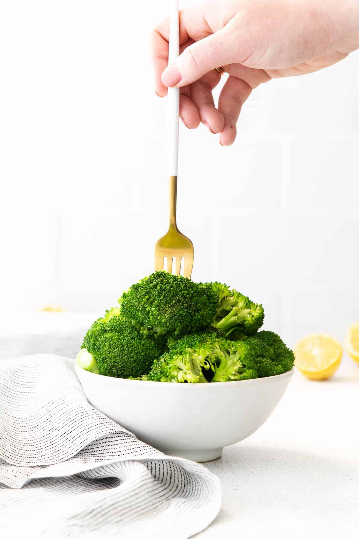 forking a piece of broccoli