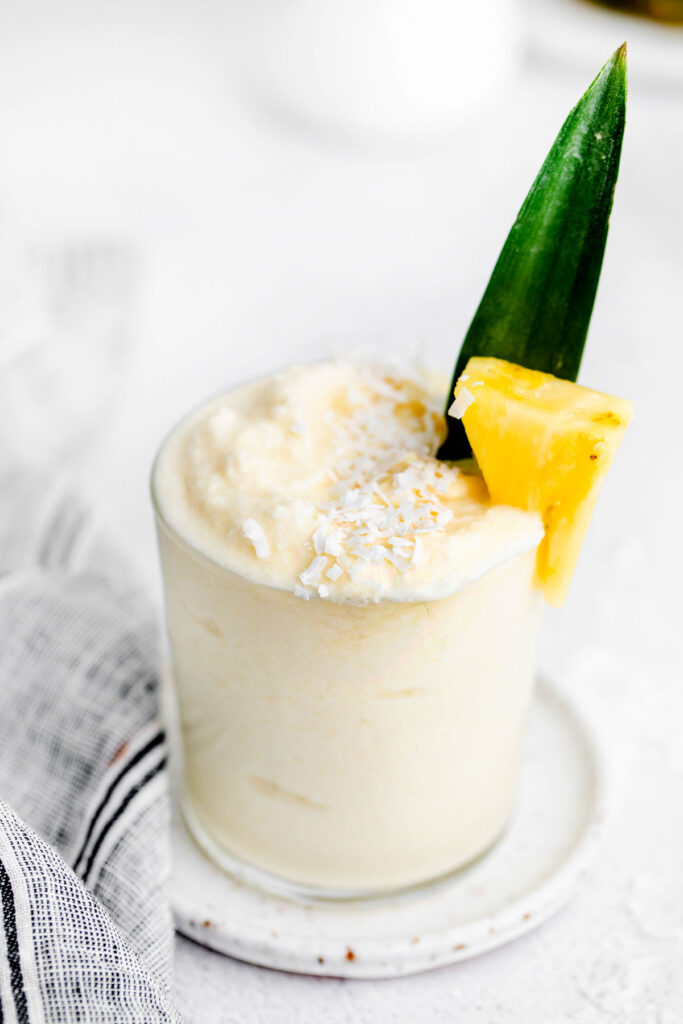 pina colada in glass with frozen pineapple