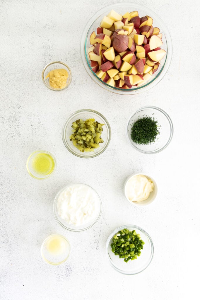 all the ingredients for red potato salad in small bowls. 