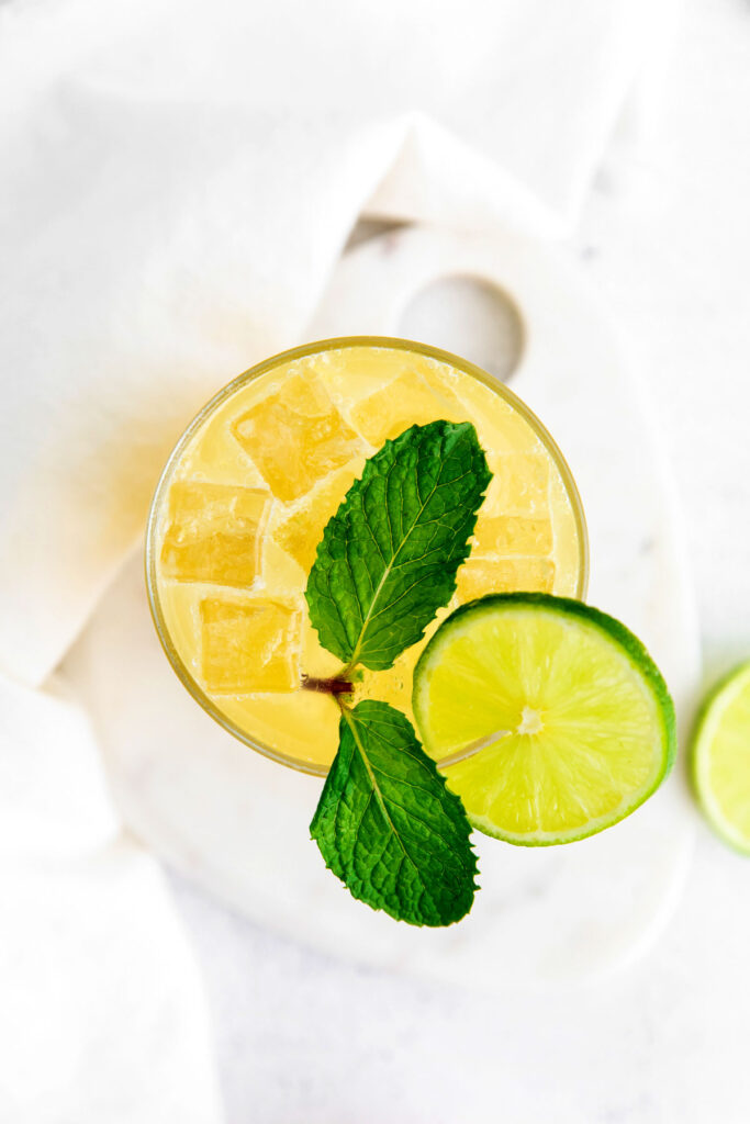 glass full of margarita and a lime wedge.