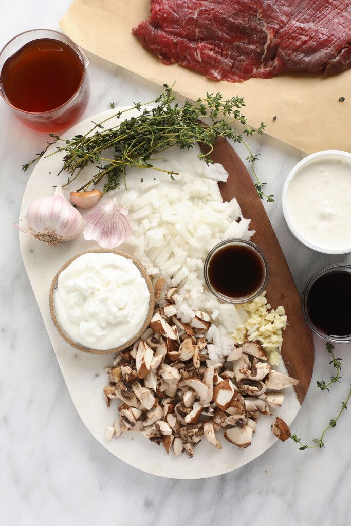 Sour cream, Greek yogurt, beef and mushrooms, and worcestershire sauce, and other ingredients for the beef stroganoff. 