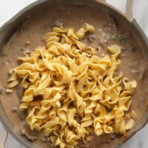 A skillet filled with beef stroganoff.
