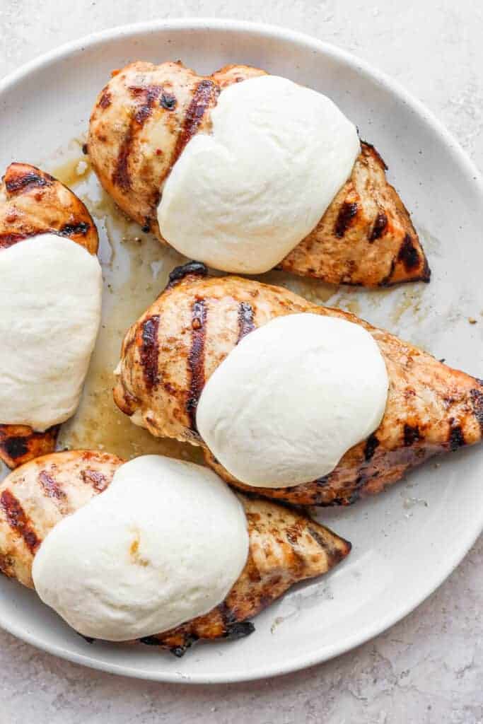 Melted mozzarella on grilled chicken breast. 