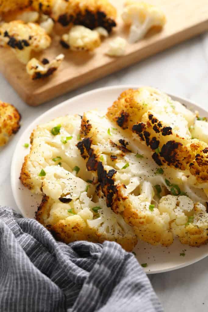 A plate of grilled cauliflower steaks.
