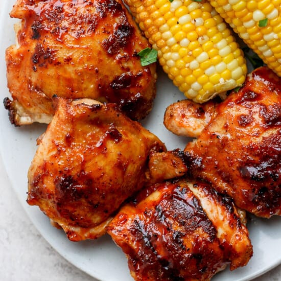 grilled chicken and corn on a plate.